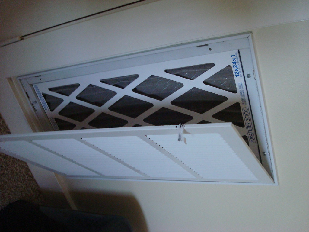 Photo réaliste illustrant filtre vmc en rénovation et ventilation